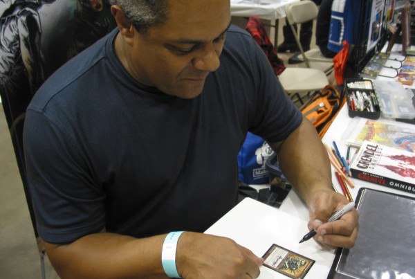 Hannibal King 001 Hannibal King signs cards for a fan at Hartford Comic Con.